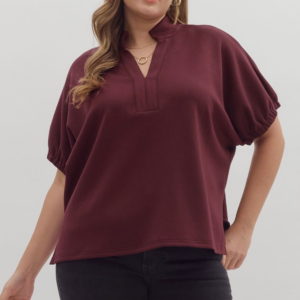 Solid short sleeve top featuring split V-neck with collar band