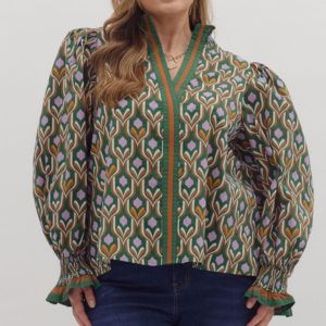 Geometric print long sleeve top featuring contrast trim split neck, smocked mock neck, and smocked cuffs